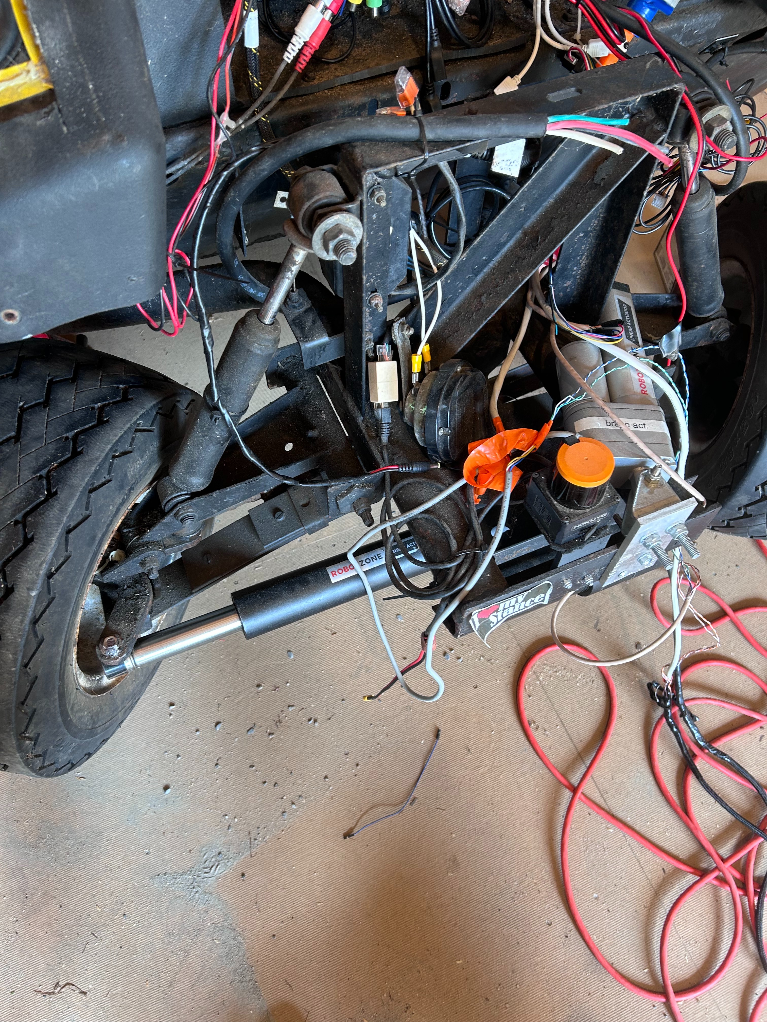 Front view of golf cart with actuators